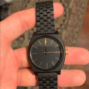 Black Nixon wrist watch